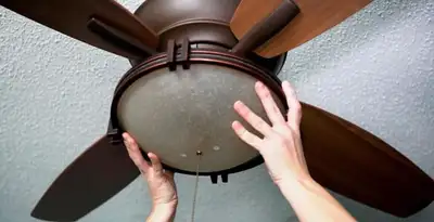 Ceiling fan repair and reinstallation on ceiling mount in Orlando, FL