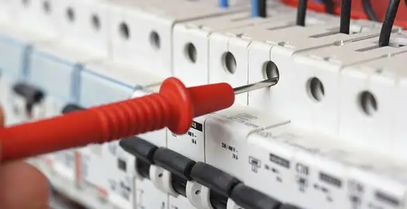 Electrical contractor testing circuit breakers during electrical repair in Ocoee, FL