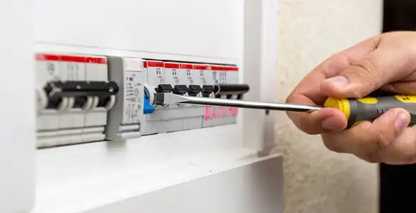 electrical panel upgrade service showing technician adjusting circuit breakers during system upgrade in Orlando, FL