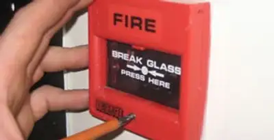 fire alarm installation service showing manual fire alarm pull station installed by licensed electricians in Orlando, FL