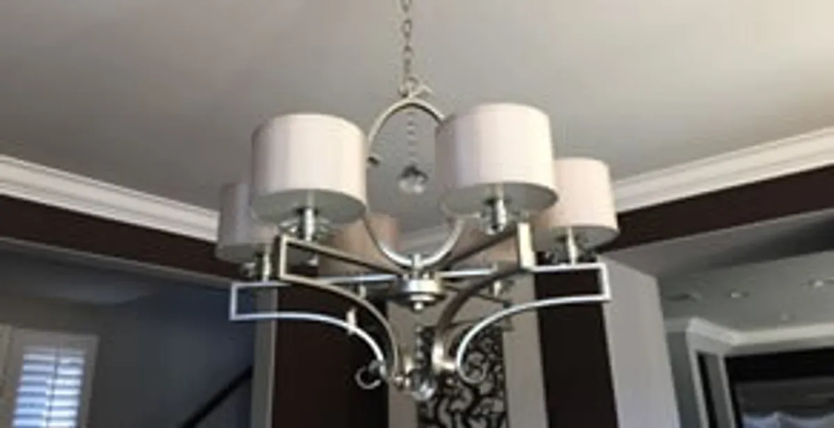 Modern chandelier installation with multiple light fixtures in Orlando, FL