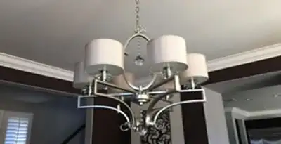 Modern chandelier installation with multiple light fixtures in Orlando, FL
