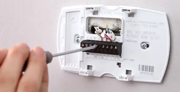 Thermostat installation service with proper wiring and secure wall mounting in Orlando, FL