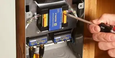 Whole home surge protection device being installed by a licensed electrician to protect electrical systems in Orlando, FL
